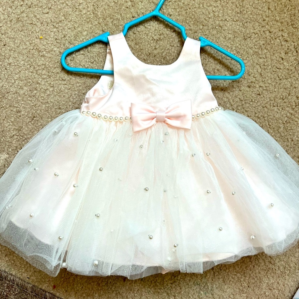 Size 6 months, w/ matching bloomers. Color is blush pink.